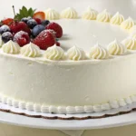 Simple White Cake with whipped cream and fresh berries on a white background