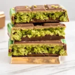 Freshly cut Dubai Chocolate Bars topped with pistachios.
