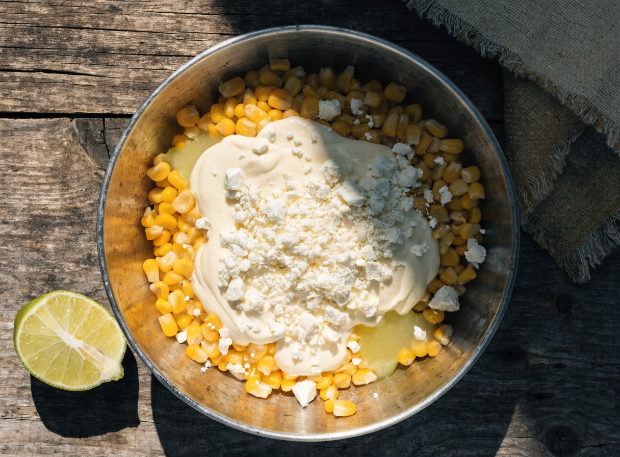 What cheese is best for elote dip if I can't find Cotija? step 2 - A detailed top-down view of a mixing bow